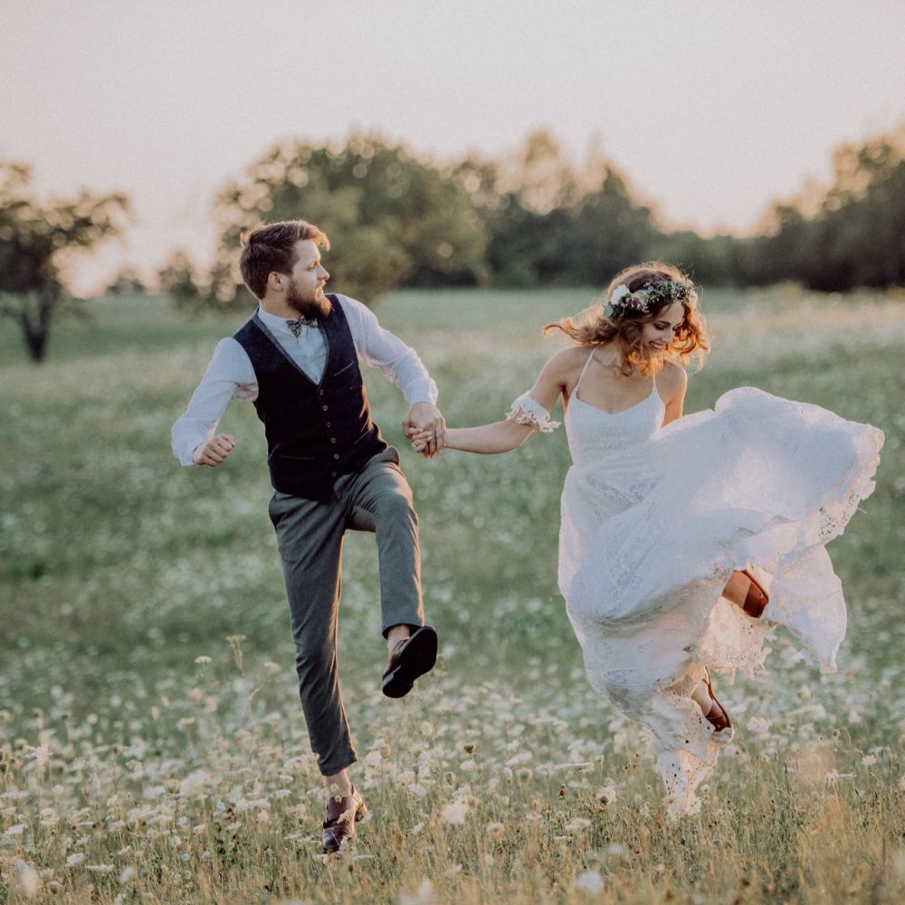 beautiful-bride-and-groom-at-sunset-in-green-natur-PS3WDVS.jpg